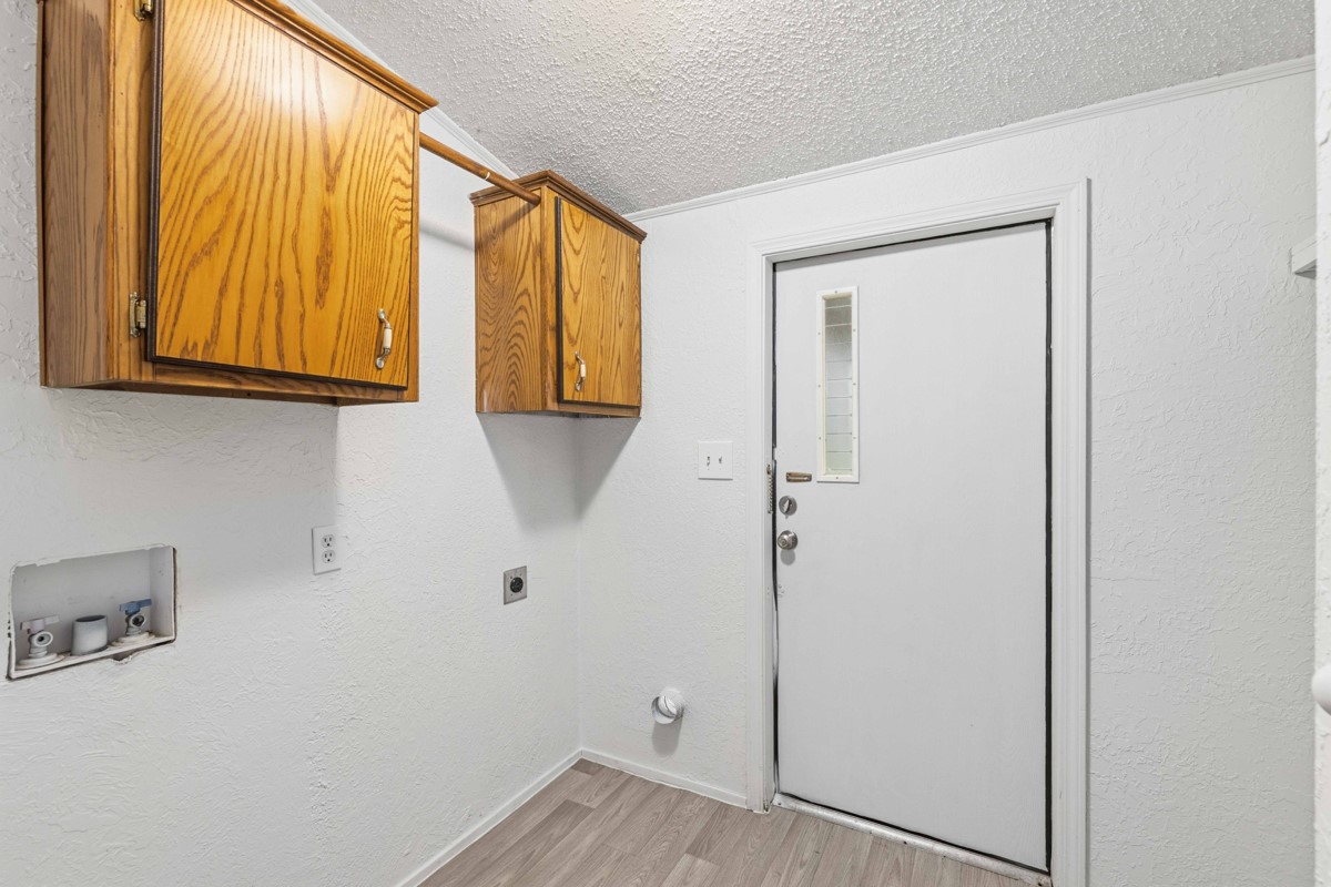 608 4th Street Blanket, TX 76432 - Photo 6 of 24 a view of hallway with wooden floor and cabinet