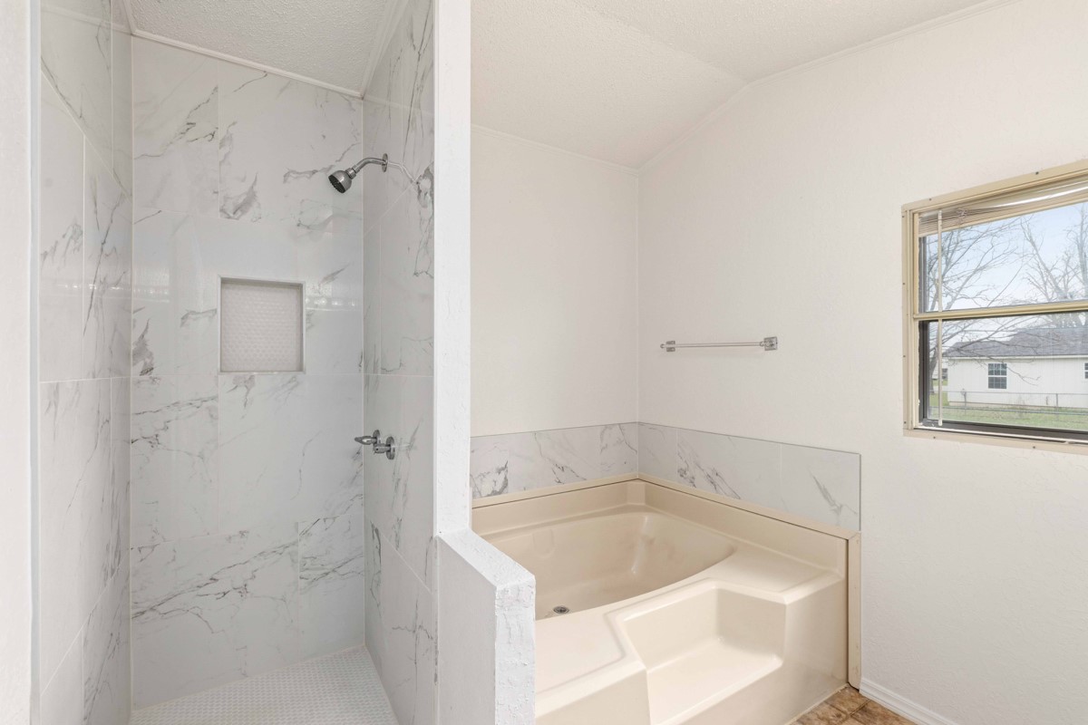 608 4th Street Blanket, TX 76432 - Photo 9 of 24 a bathroom with a bathtub