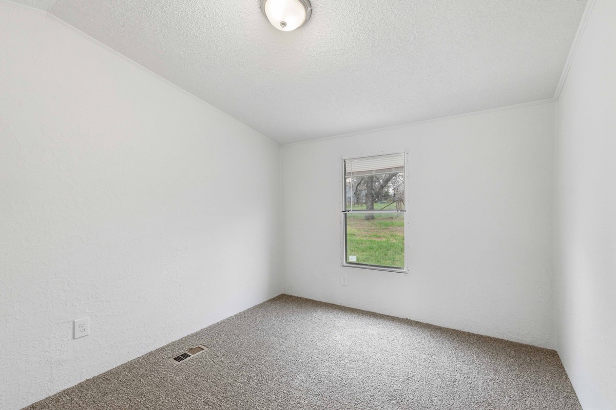 608 4th Street Blanket, TX 76432 - Photo 10 of 24 an empty room with windows