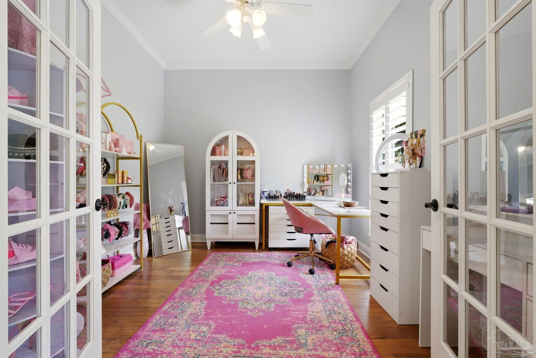 5931 Otter Point Road Pensacola, FL 32504 - Photo 21 of 67 a bed room with a bed and a book shelf