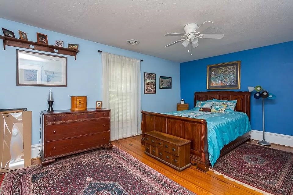 163 Pleasant View Road Staunton, VA 24401 - Photo 23 of 50 a bedroom with a bed and a chandelier