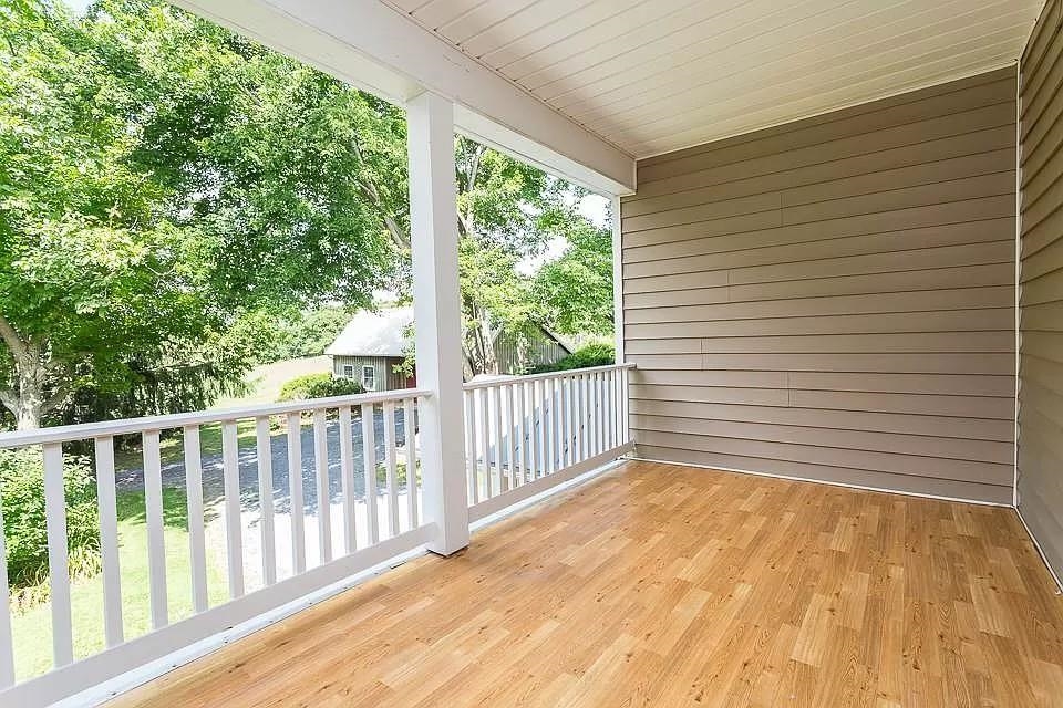 163 Pleasant View Road Staunton, VA 24401 - Photo 24 of 50 a view of a porch with wooden floor and roof