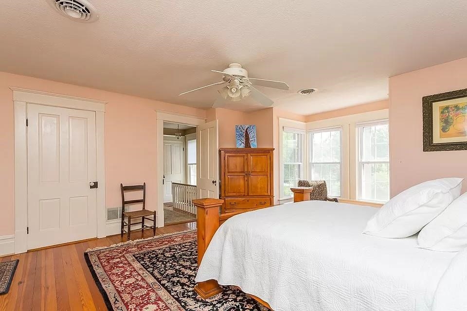 163 Pleasant View Road Staunton, VA 24401 - Photo 26 of 50 a bedroom with a large bed and a chandelier
