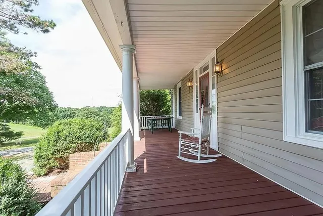 a view of a patio with wooden floor