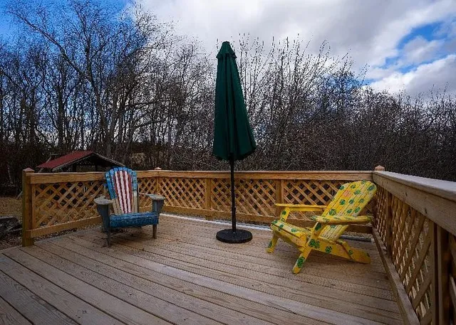 a view of terrace with seating space and trees
