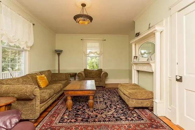 a living room with furniture and a rug