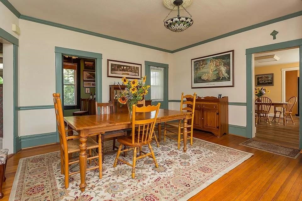 163 Pleasant View Road Staunton, VA 24401 - Photo 10 of 50 a dining room with wooden floor a chandelier a wooden table and chairs