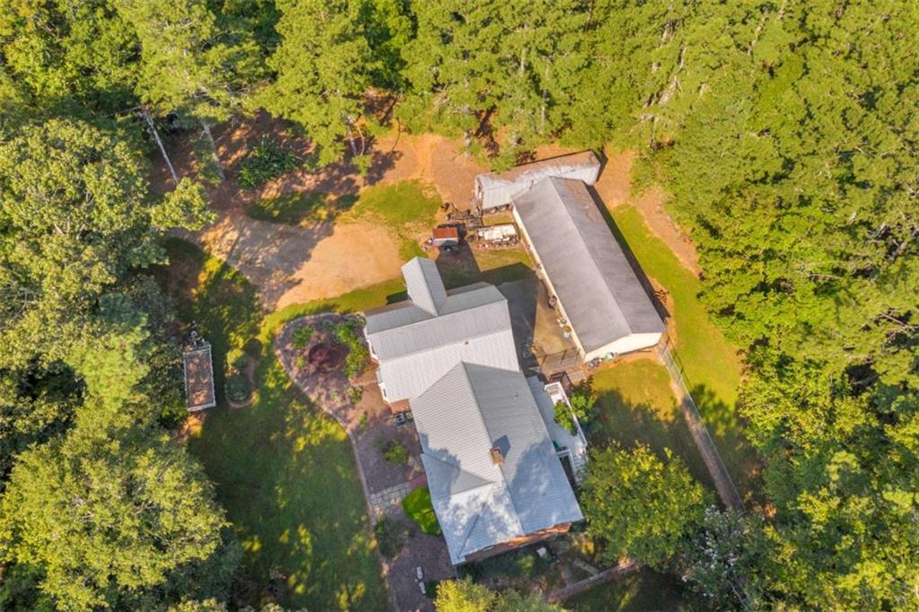 1329 Harmony Grove Church Road Auburn, GA 30011 - Photo 15 of 20 aerial view of a house with swimming pool and lawn chairs