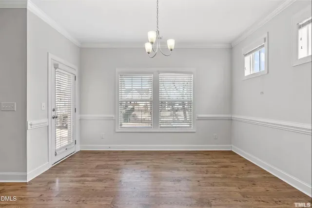a view of an empty room with a ceiling fan