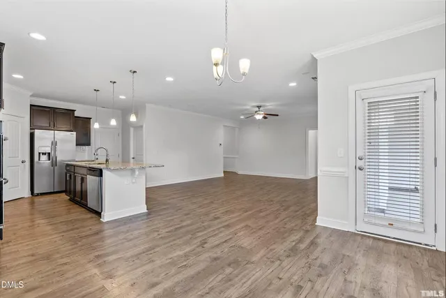 a spacious bathroom with a shower sink and mirror