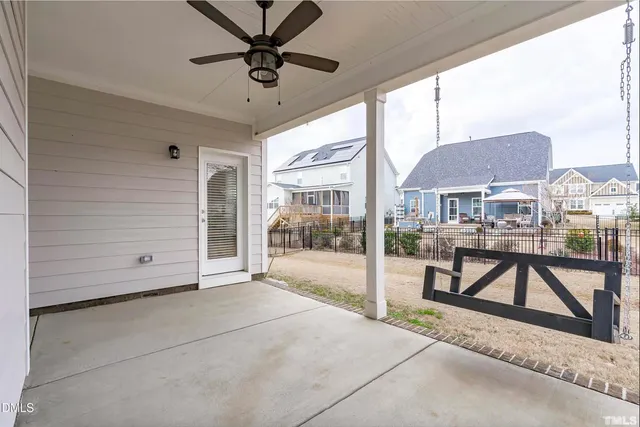 an empty room with windows and wooden floor