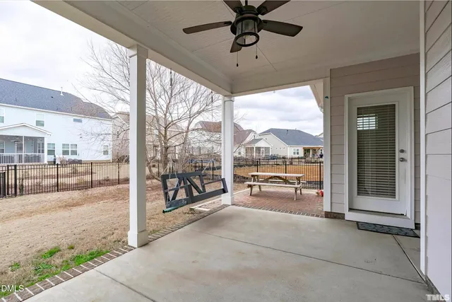 a open kitchen with stainless steel appliances granite countertop a stove refrigerator and wooden floor