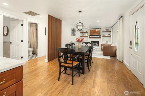 a view of a dining room with furniture and wooden floor