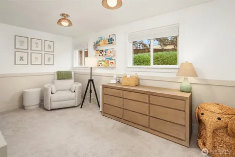 a bedroom with a bed and a couch