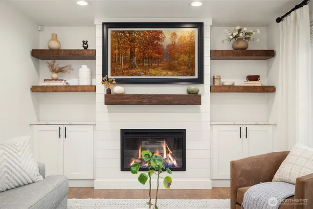 a living room with furniture and a fireplace