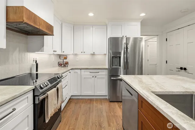a kitchen with a sink stove and refrigerator