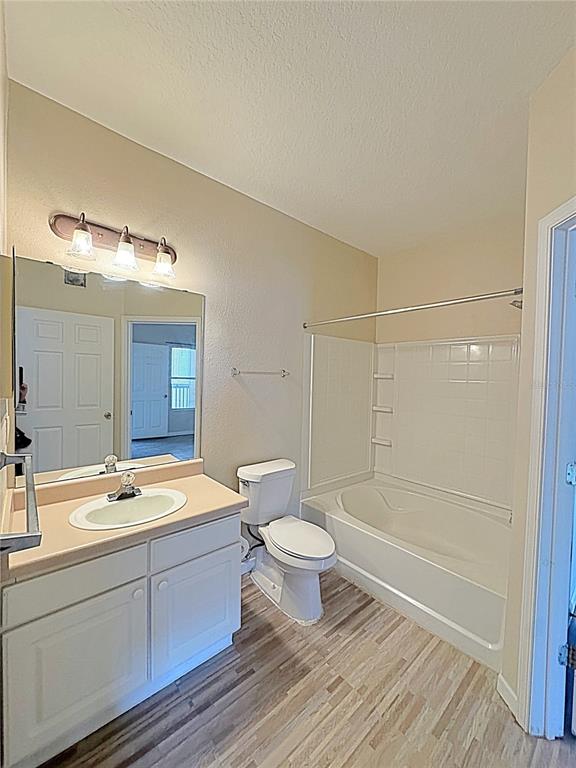 10764 70th Avenue, Unit 8201 Seminole, FL 33772 - Photo 13 of 37 a bathroom with a double vanity sink toilet and shower