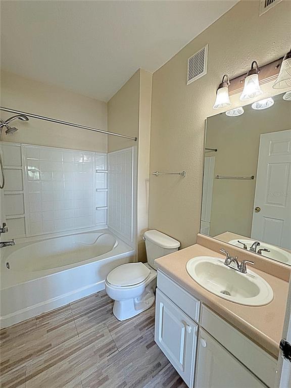 10764 70th Avenue, Unit 8201 Seminole, FL 33772 - Photo 16 of 37 a bathroom with a sink toilet a mirror and shower