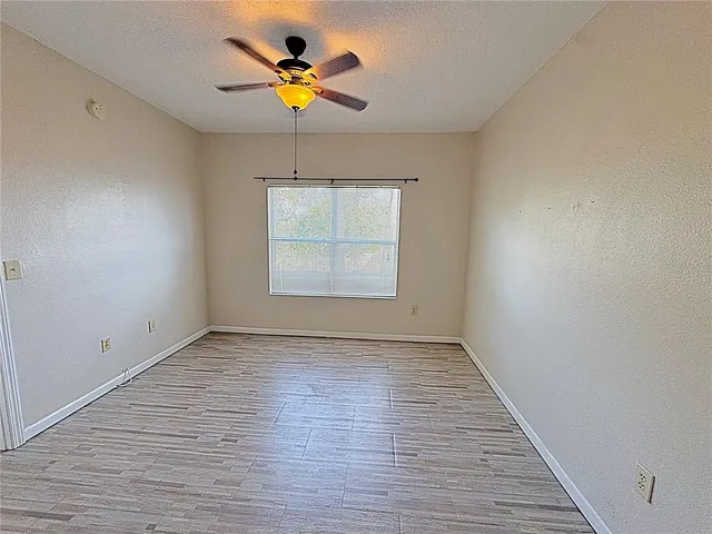 a view of a dining room with furniture water view and large windows