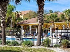 10764 70th Avenue, Unit 8201 Seminole, FL 33772 - Photo 22 of 37 a front view of a house with a yard