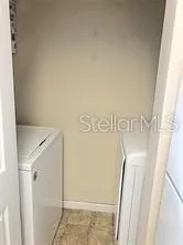 a bedroom with a bed and a mirror