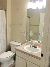 a view of a room with wooden floor and closet