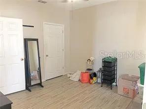 a bathroom with a granite countertop toilet sink and mirror
