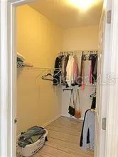 a bathroom with a granite countertop sink a toilet and a shower
