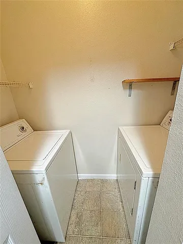 a view of an empty room and wooden floor