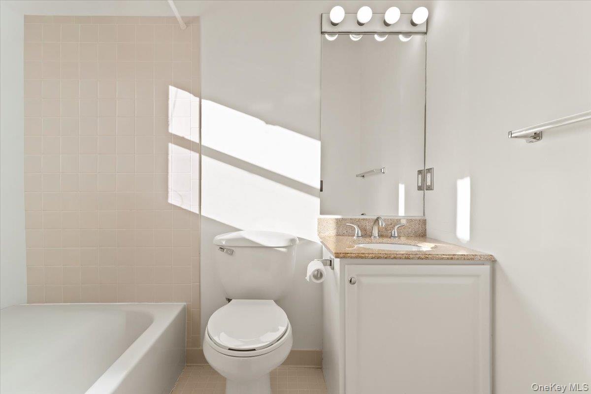 51 Hemlock Circle Peekskill, NY 10566 - Photo 14 of 21 a bathroom with a granite countertop sink toilet and shower