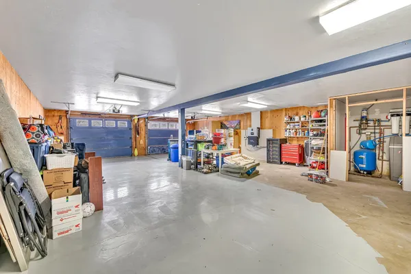 a view of a garage with rack and bicycle