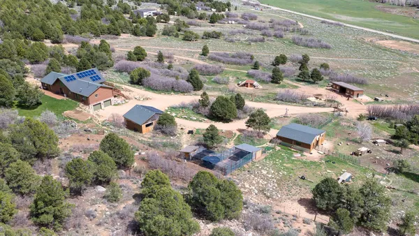 an aerial view of residential house with outdoor space