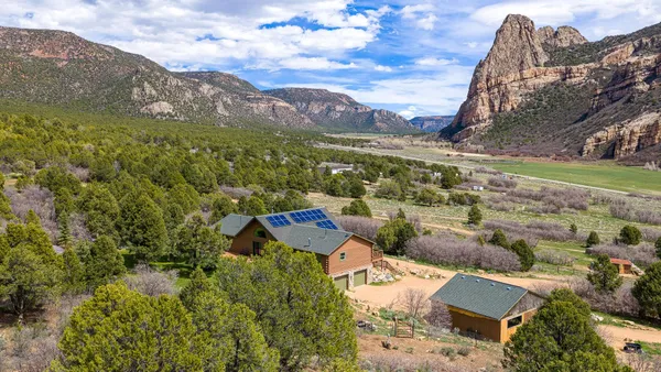 an aerial view of residential houses with outdoor space