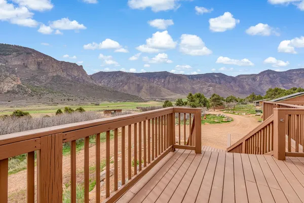 a view of city and mountain from a balcony