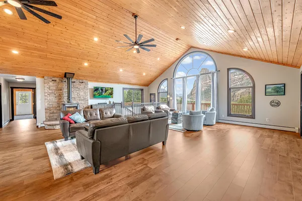 a living room with furniture and a large window