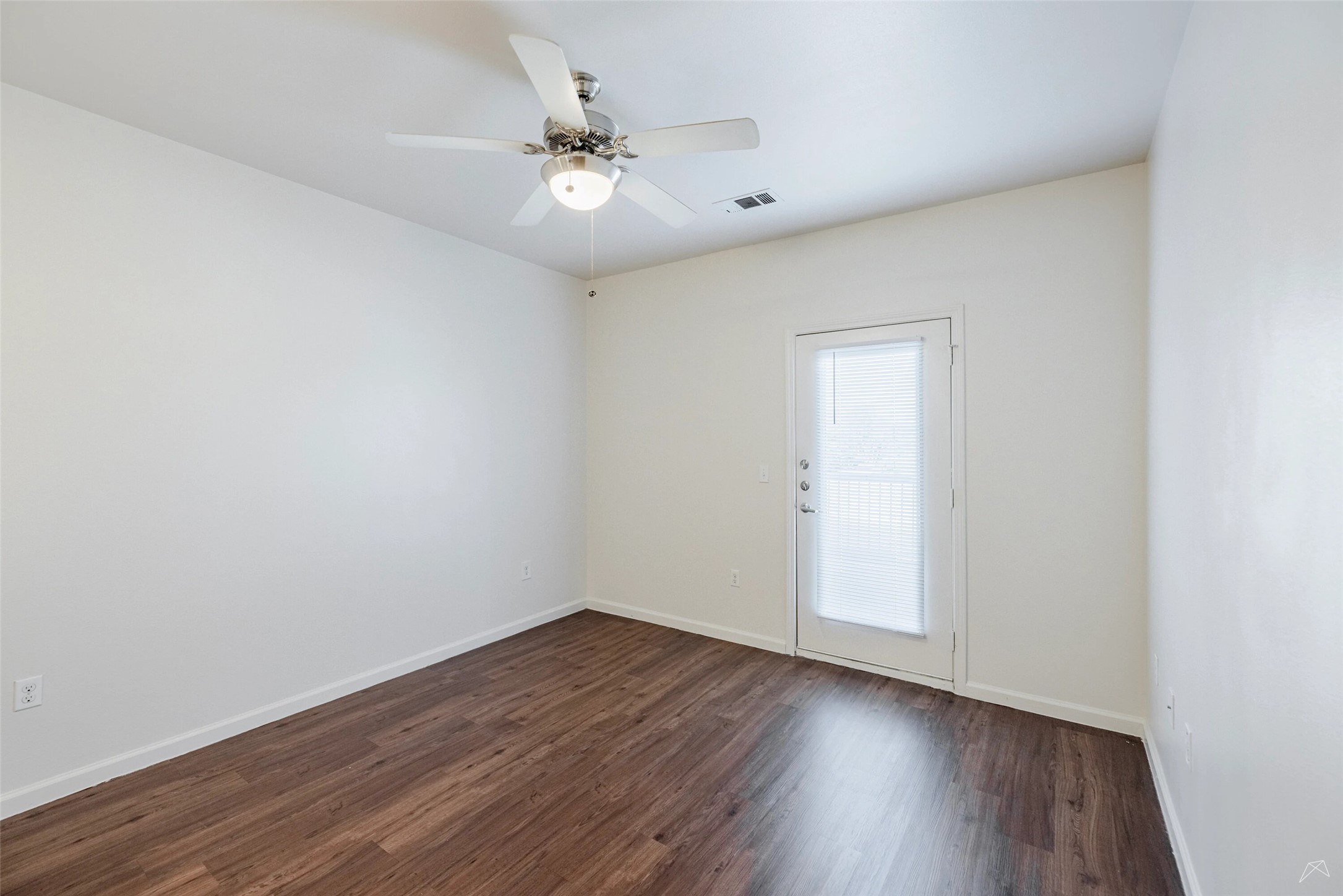 5605 Springdale Road, Unit 333413 Austin, TX 78723 - Photo 8 of 27 a view of an empty room with wooden floor