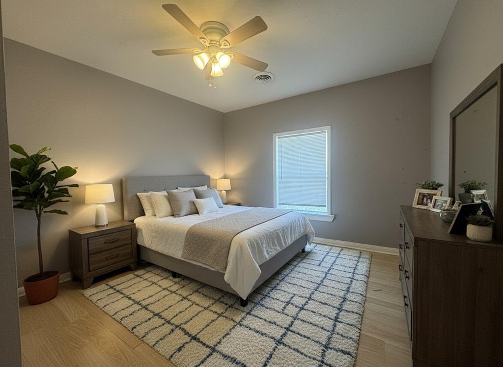 3520 Colcord Avenue Waco, TX 76707 - Photo 4 of 17 Virtually Staged Bedroom featuring light wood-type flooring and a ceiling fan