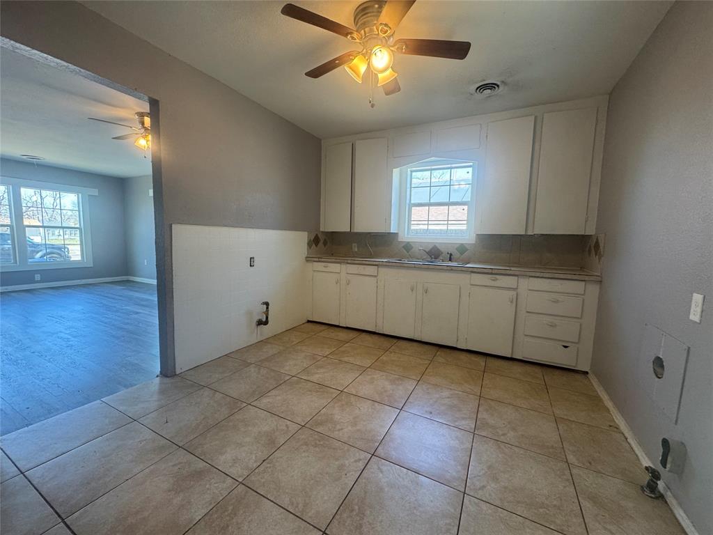 3520 Colcord Avenue Waco, TX 76707 - Photo 6 of 17 Laundry area featuring ceiling fan and light tile patterned floors