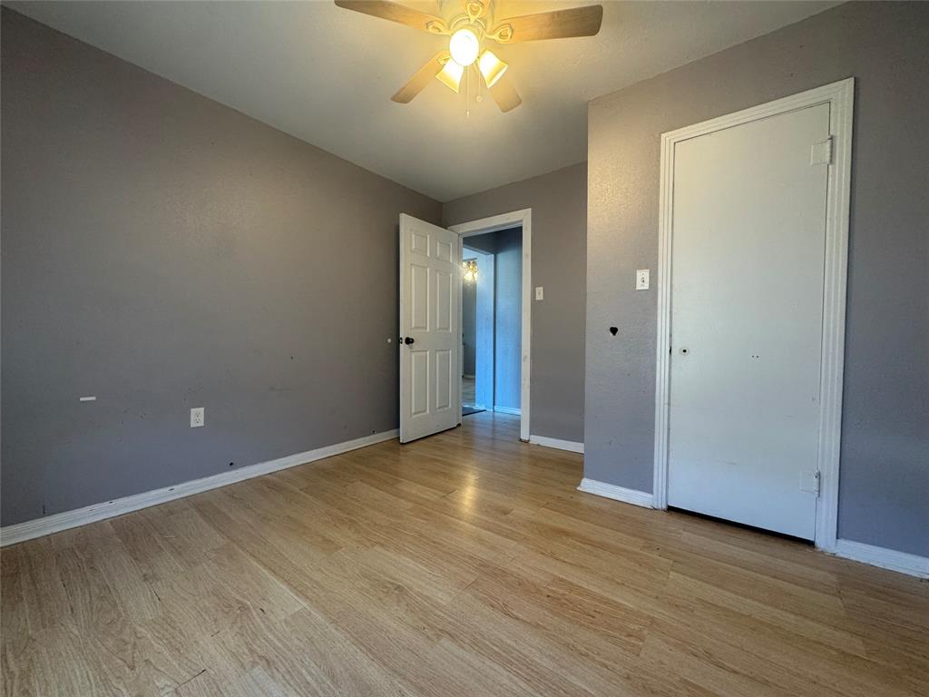 3520 Colcord Avenue Waco, TX 76707 - Photo 8 of 17 Unfurnished bedroom featuring light wood-style floors and a ceiling fan