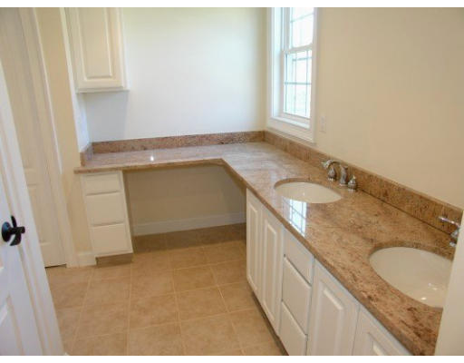 27 Hartwell Place Canton, MA 02021 - Photo 11 of 12 a bathroom with a granite countertop sink and a vanity