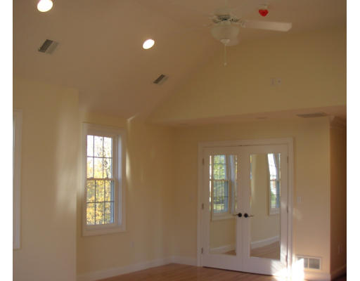 27 Hartwell Place Canton, MA 02021 - Photo 6 of 12 a view of an empty room with wooden floor and a window