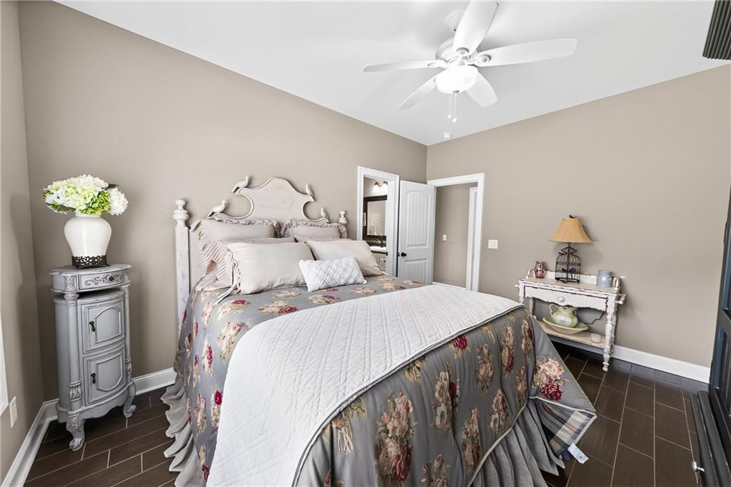 611 Padgetts Road Opelika, AL 36804 - Photo 34 of 64 Recessed lighting, ceiling fan, warm neutral wall tones, white trim, and dark wood-look flooring