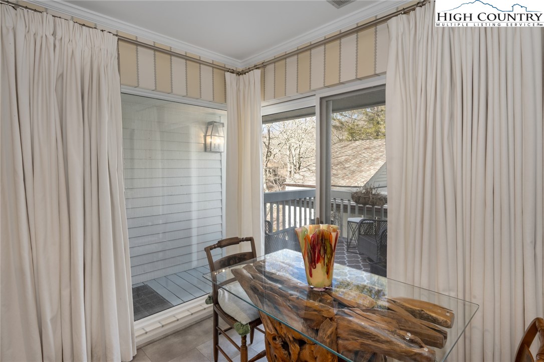 404 Moon Run, Unit D Linville, NC 28646 - Photo 12 of 27 a view of a dining room with furniture window and outside view
