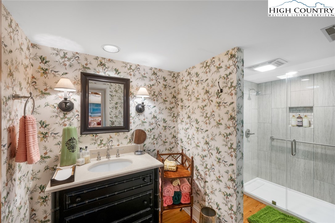 404 Moon Run, Unit D Linville, NC 28646 - Photo 20 of 27 a bathroom with a sink and a mirror