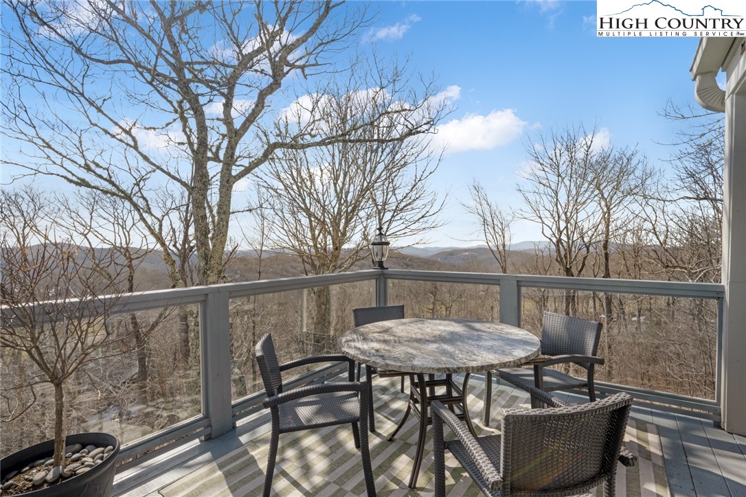 404 Moon Run, Unit D Linville, NC 28646 - Photo 22 of 27 a view of a chairs and table in the balcony