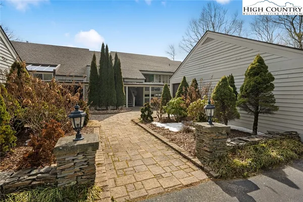 a view of house with yard