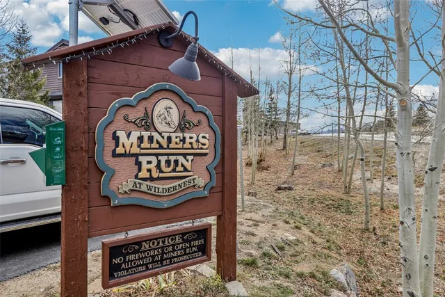 a view of a house with a yard and furniture