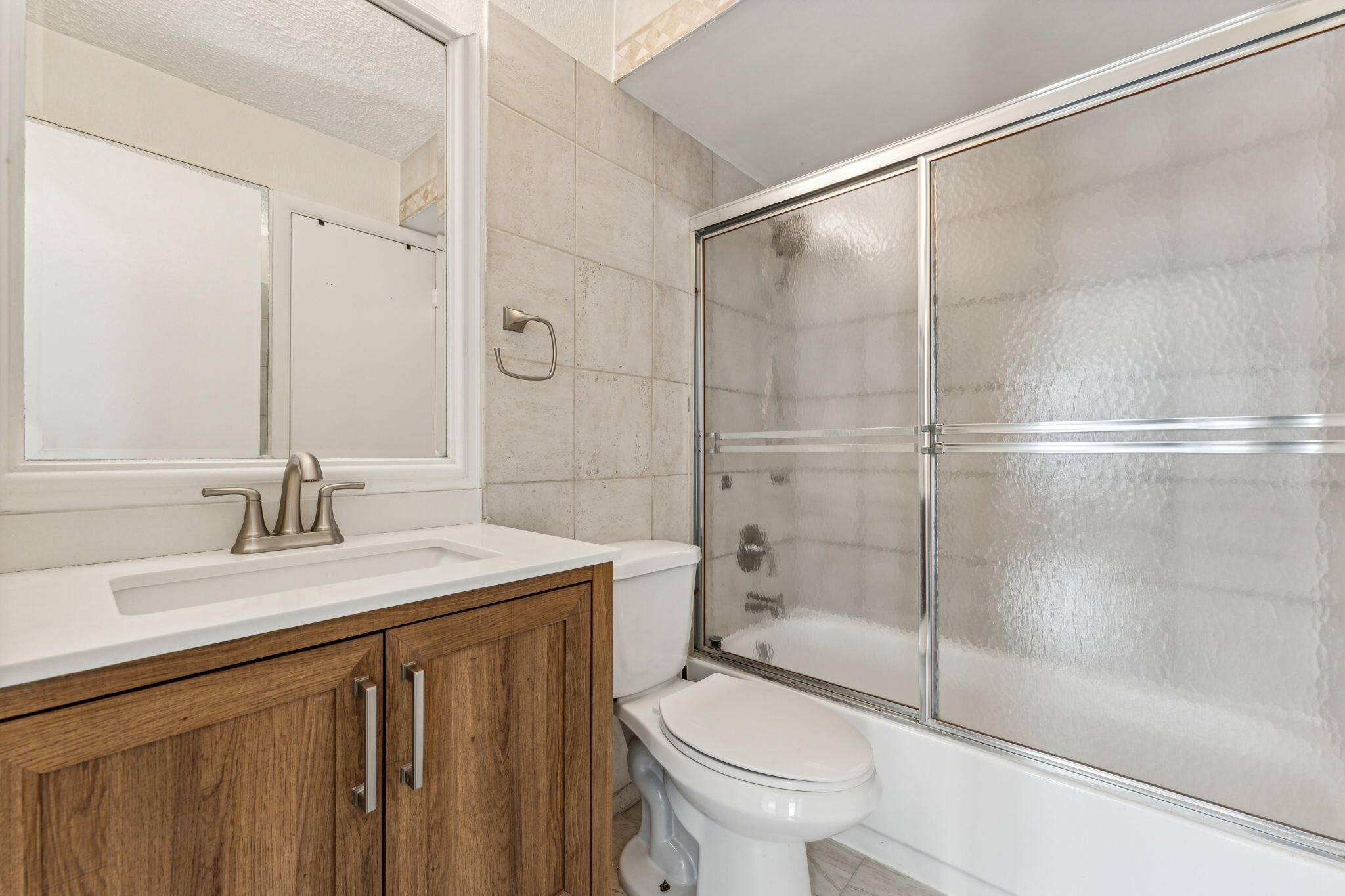 5312 Bosque Lane, Unit 80 West Palm Beach, FL 33415 - Photo 11 of 20 a bathroom with a sink toilet and shower