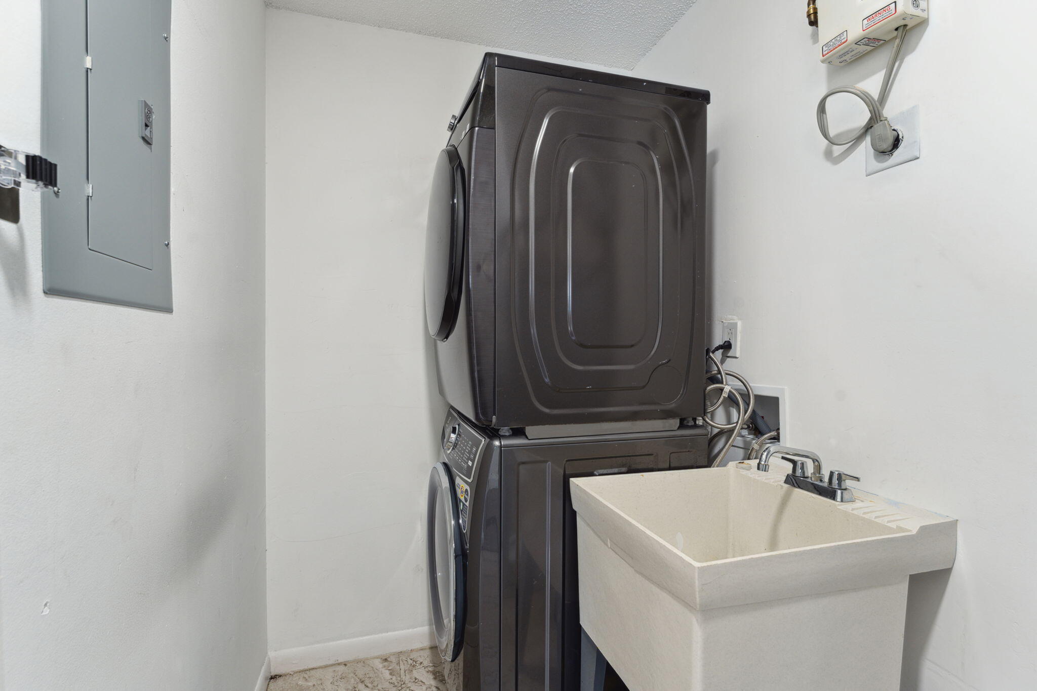 5312 Bosque Lane, Unit 80 West Palm Beach, FL 33415 - Photo 14 of 20 a bathroom with a sink a mirror and shower