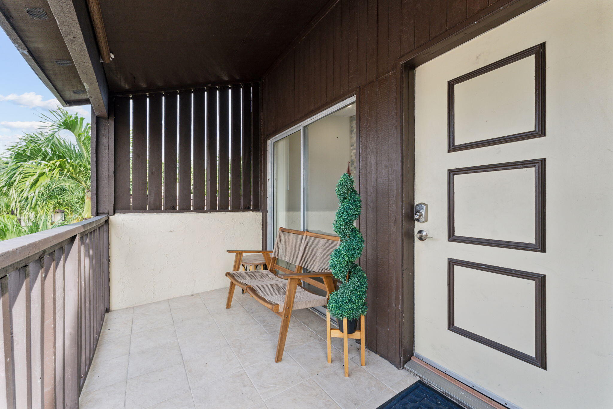 5312 Bosque Lane, Unit 80 West Palm Beach, FL 33415 - Photo 15 of 20 a view of porch with seating space